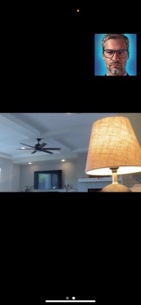iOS Screenshot of zoom meeting with a lit lamp